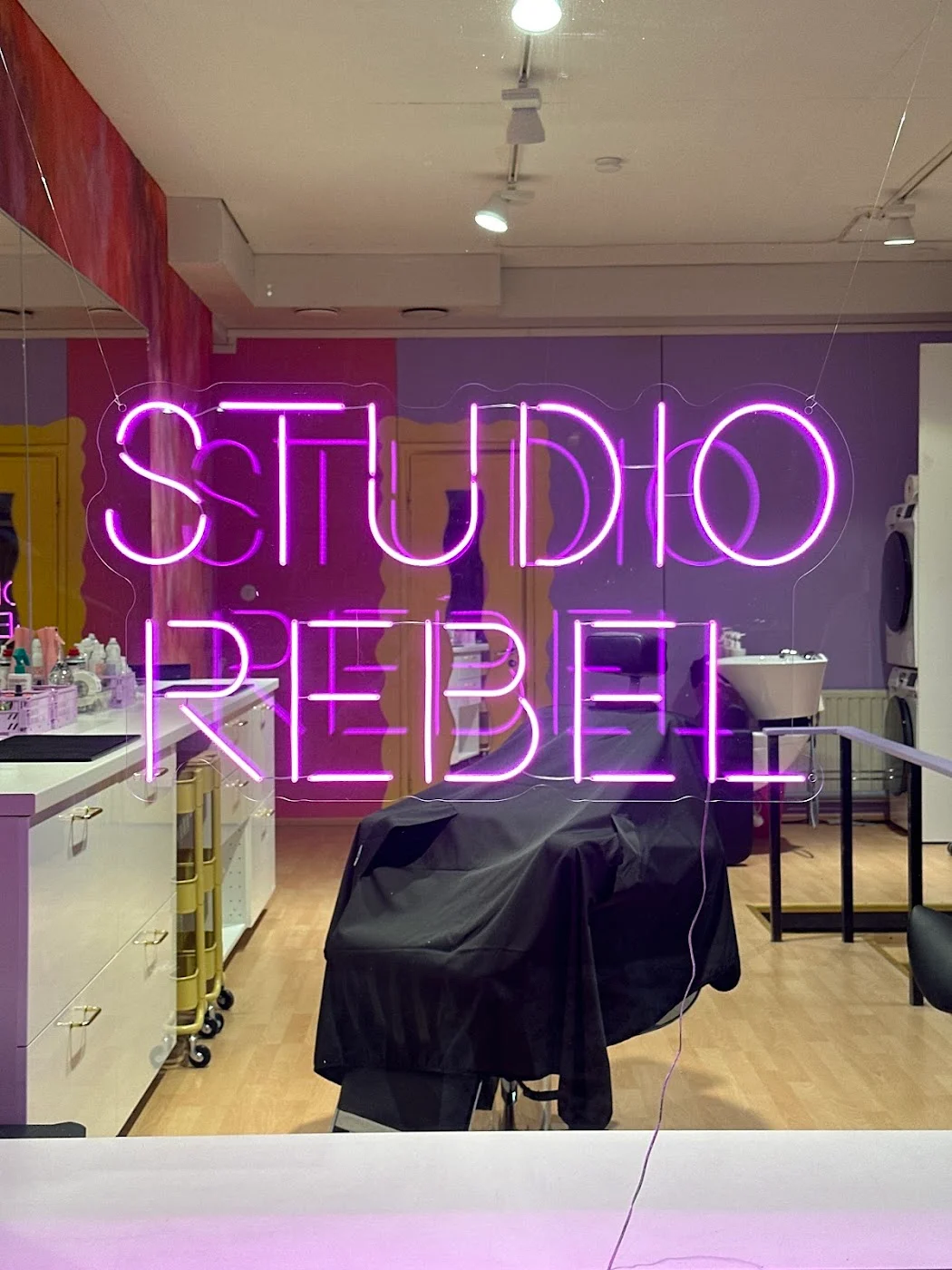 Studio Rebel LED neon sign in a hair salon — photo from the client’s Google review