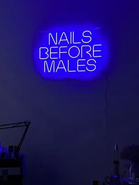 Blue LED neon Nails Before Males sign in a nail salon