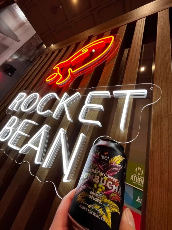 Rocket Bean LED neon sign with an orange rocket
