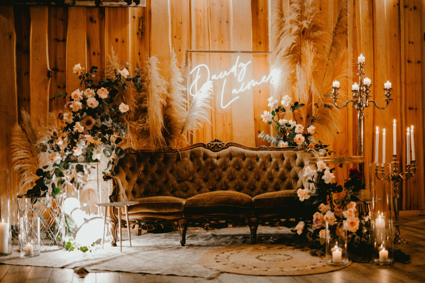 Warm white LED neon script sign above a wedding sofa