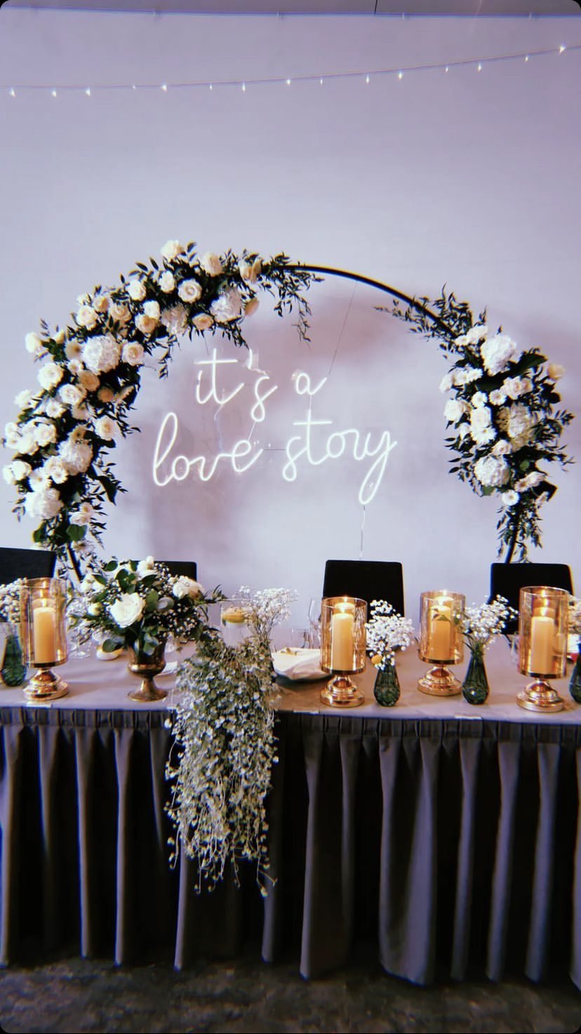 Wedding neon sign in a flower arch