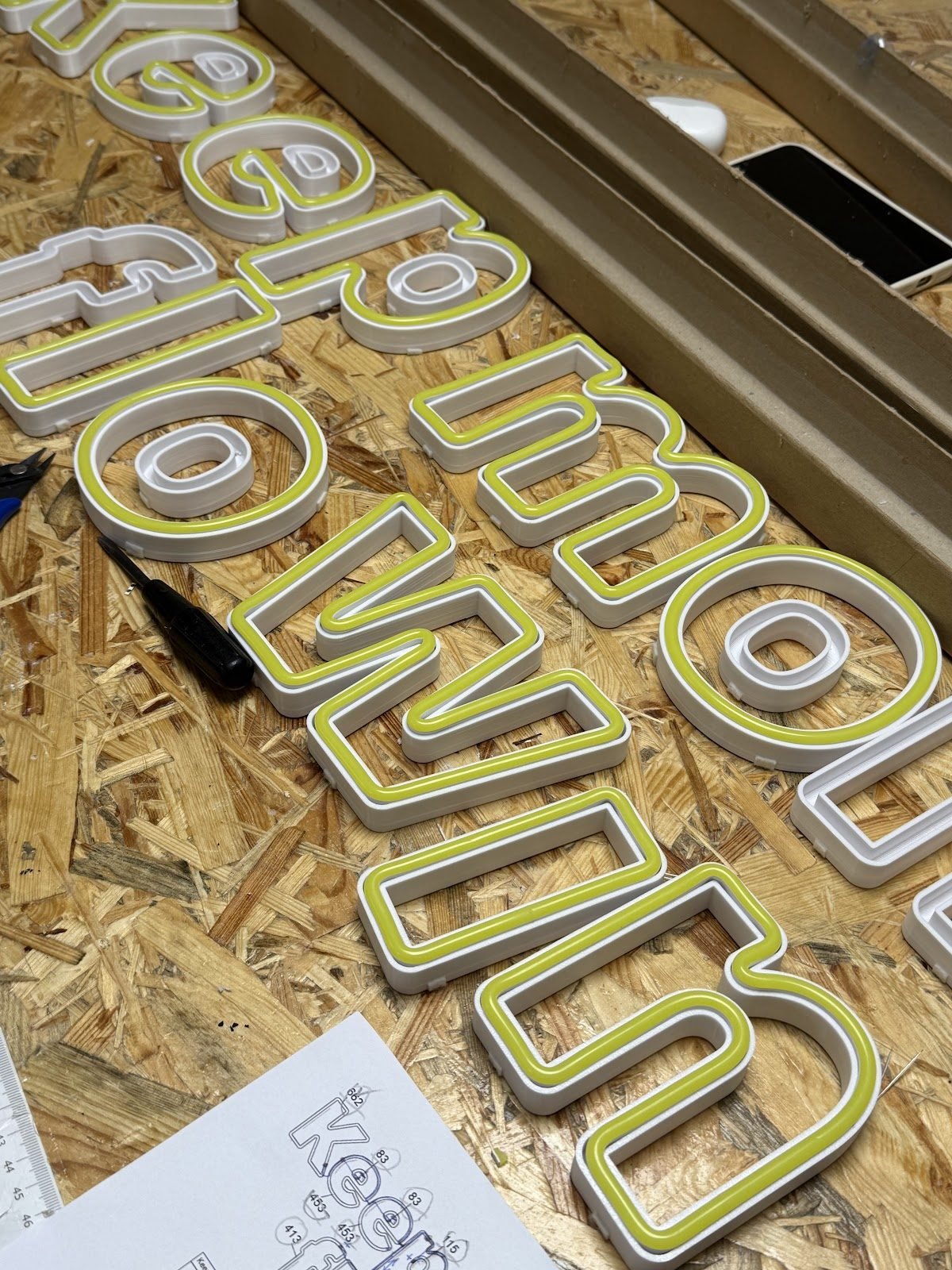 3D letters with a neon outline in the workshop