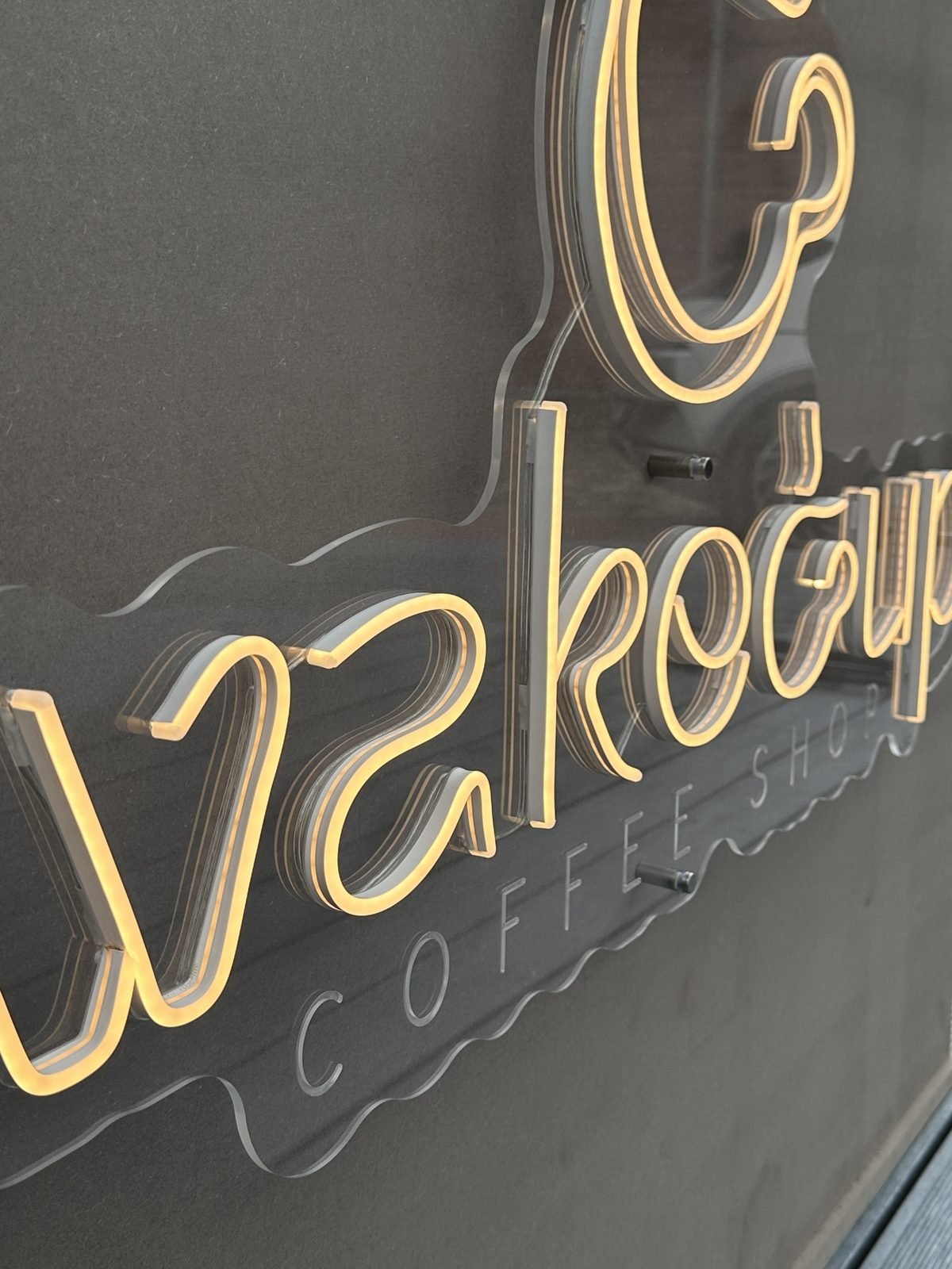 Coffee shop logo in warm white neon