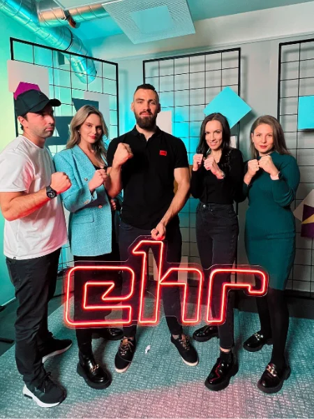 Red LED neon company logo at an office launch with the team