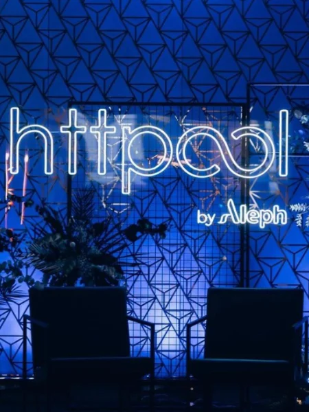 Blue LED neon Httpool logo on an office wall