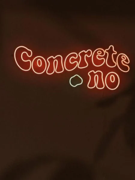 Red LED neon Concrete.no logo on a dark wall