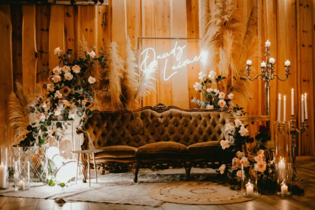 Warm white LED neon script sign above a wedding sofa