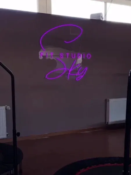 Purple LED neon script sign in a yoga studio