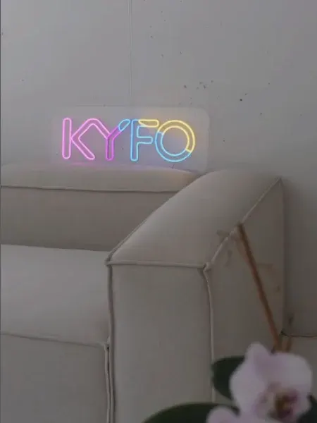Pastel LED neon KYFO logo in a showroom