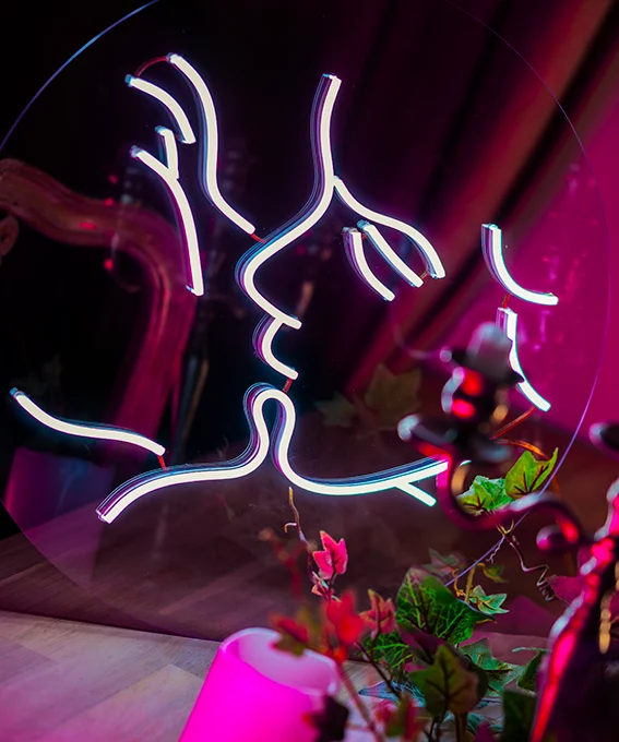 Close-up of a finished white LED neon line-art sign